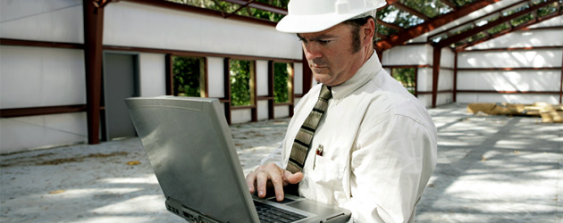 Business-Man-with-Computer-Header-630x250