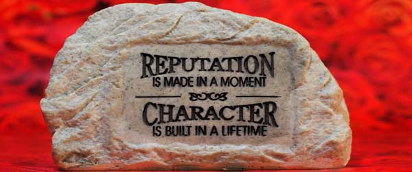 Carved stone reading Reputation is made in a moment, Character is built in a lifetime
